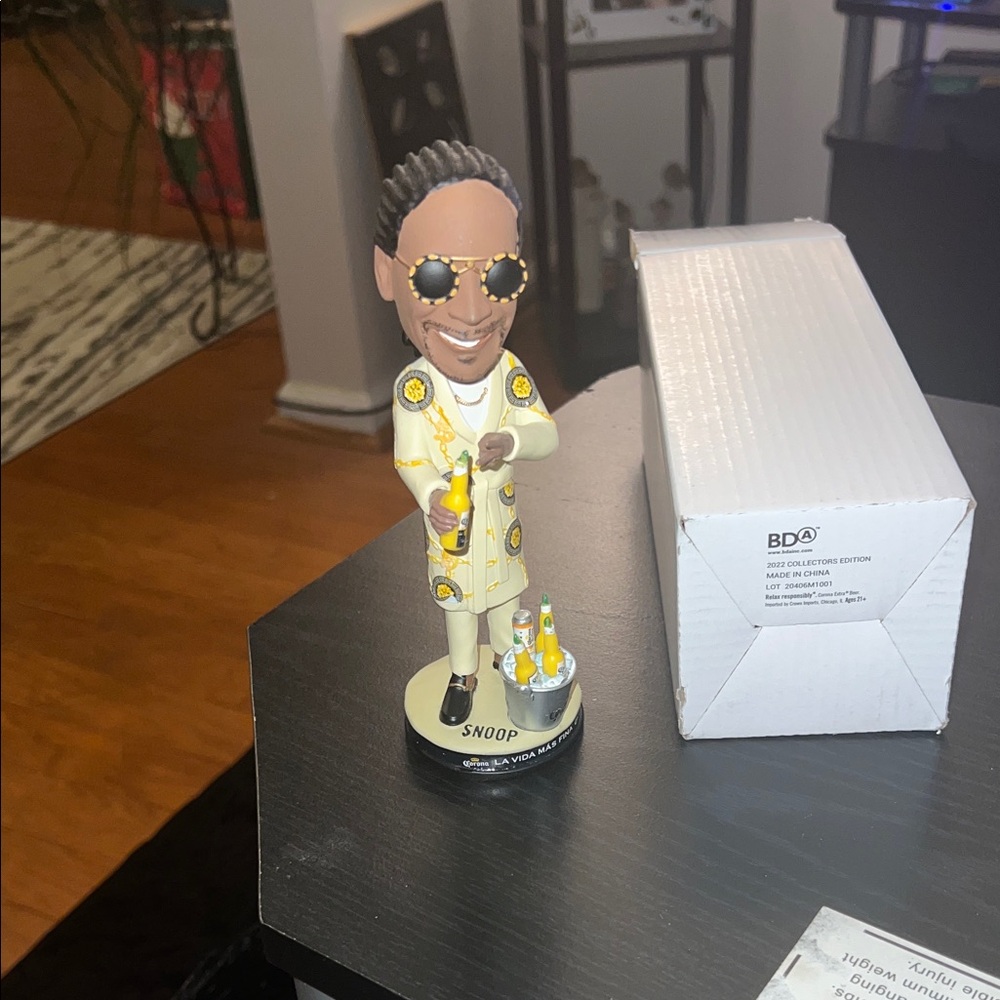 Corona Bobblehead Sculpture with Yellow Accents